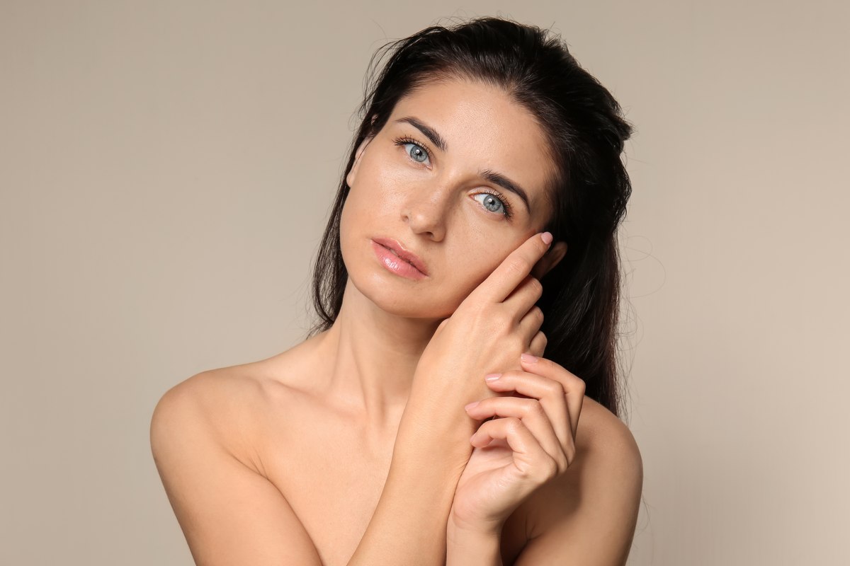 The natural portrait with slightly uneven skin tone and light.